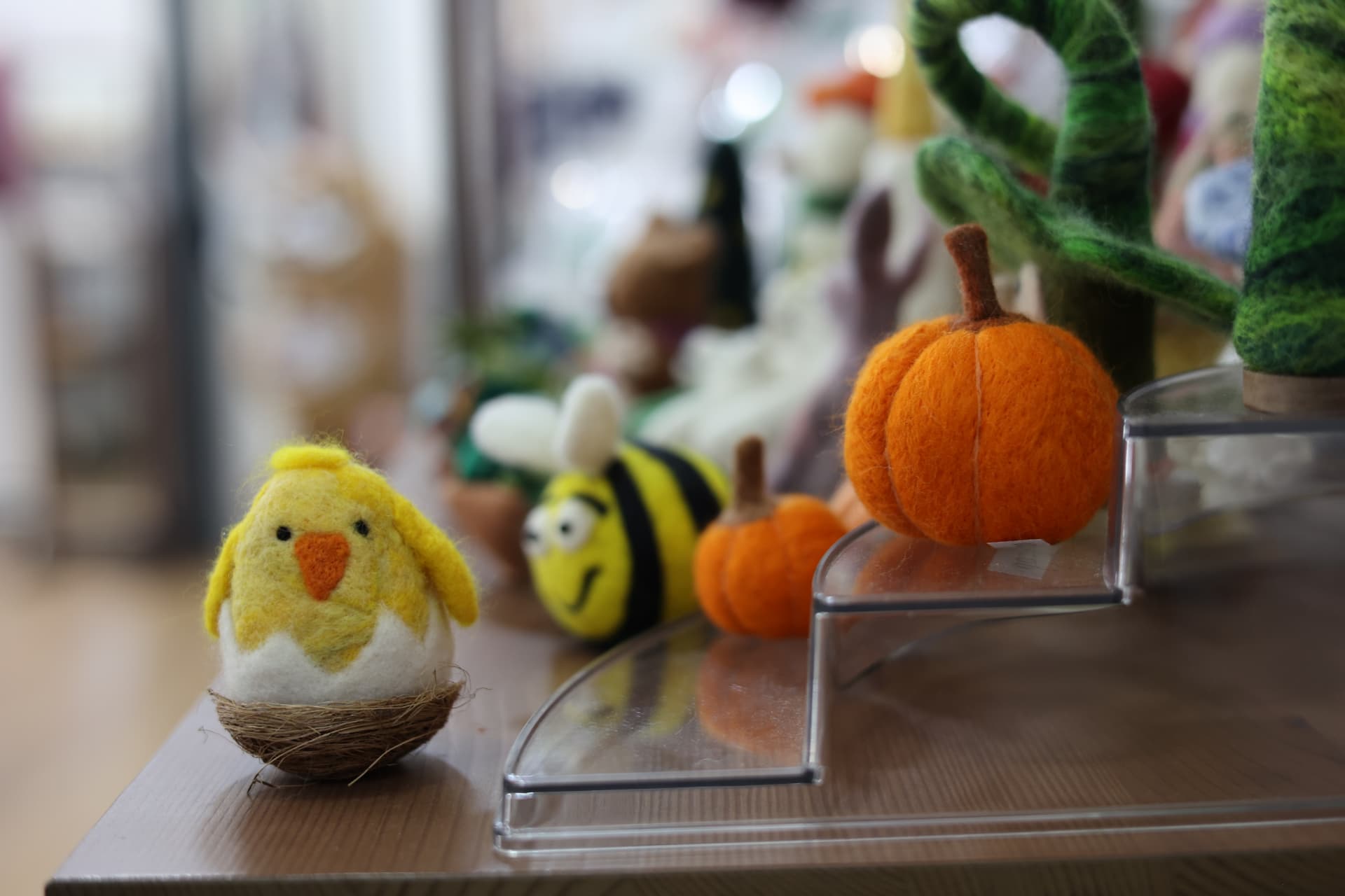 Cafe interior photography Wells Somerset showing felted ornaments on a gift shop display shelf