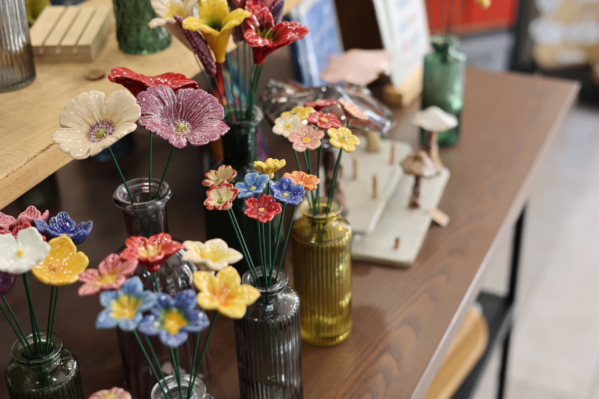 Restaurant photography Wells Somerset showing handmade ceramic flowers styled on a table setting