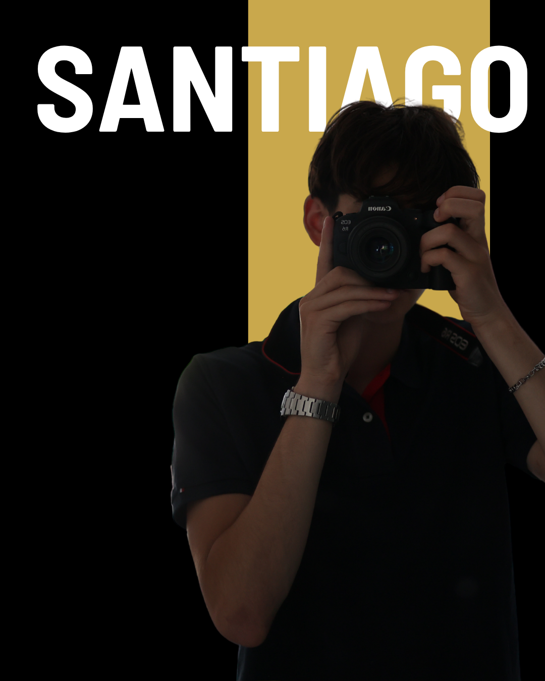 Santiago, Somerset commercial photographer, holding a Canon camera against a black and gold backdrop