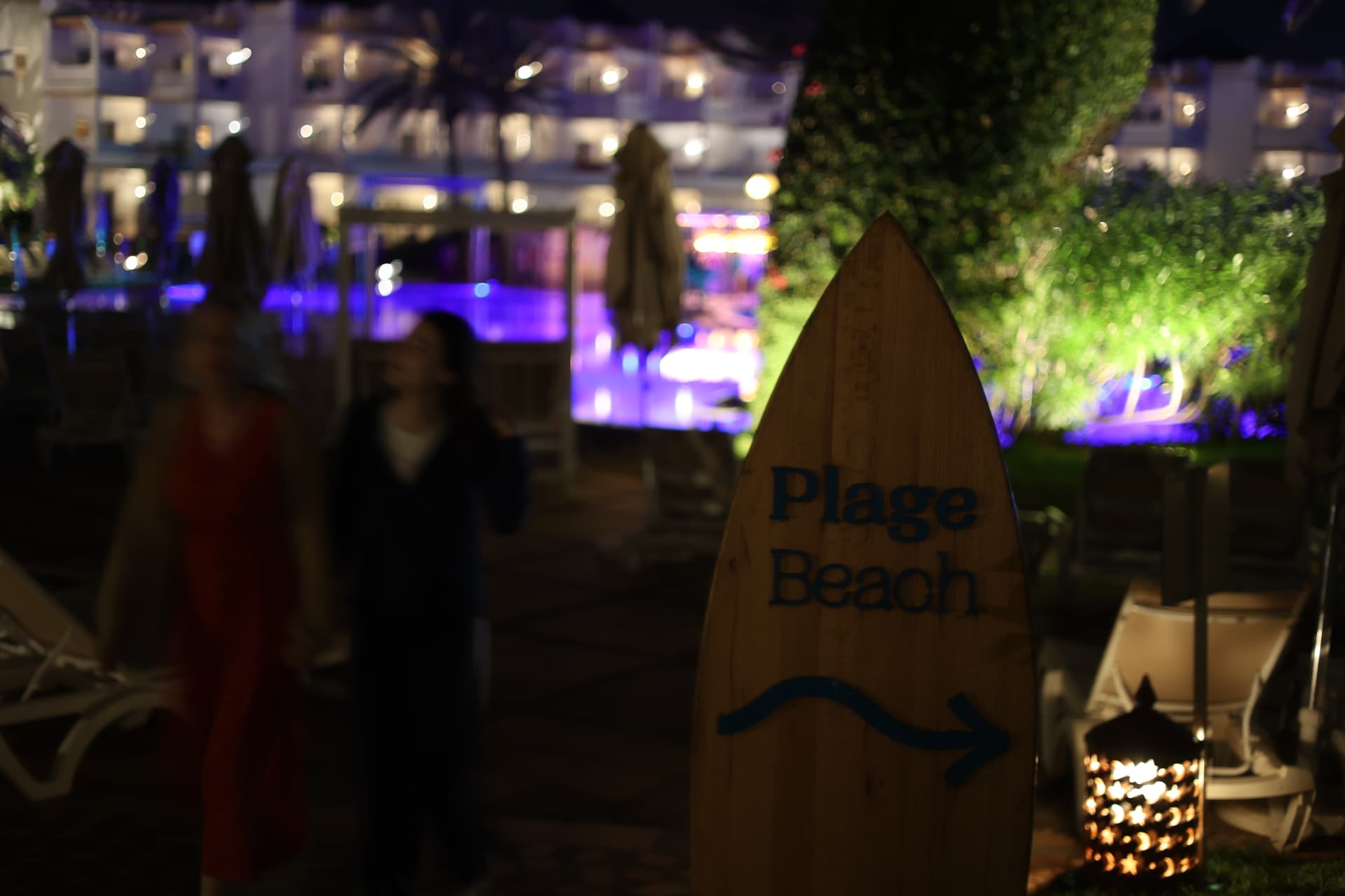Venue signage and atmosphere photography for cafes and shops in Somerset, wooden beach sign at dusk
