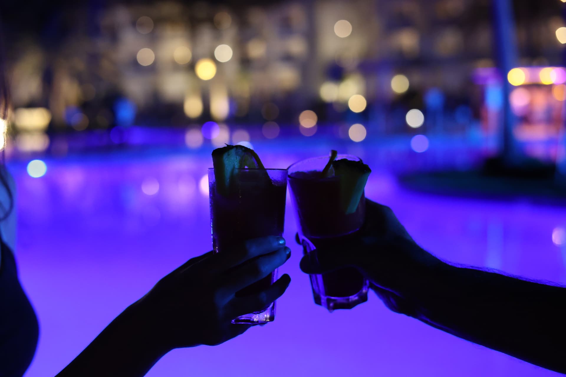 Cocktail drinks photography for bars and restaurants in Wells Somerset, two glasses toasting at night